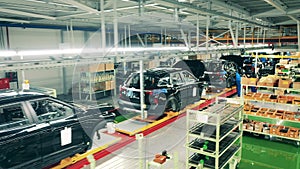 Automobile, car factory conveyor. Car bodies in the factory unit in the process of assembly