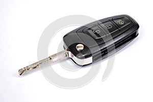 Automobile charm of the signaling with the ignition key from the car Ford on white background.