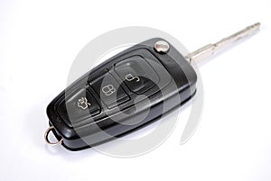 Automobile charm of the signaling with the ignition key from the car Ford on white background.