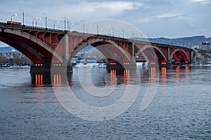 Automobile Communal Bridge 1961 with night illumination across the Yenisei River in the city of Krasnoyarsk. Russia