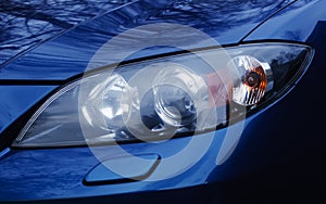 Automobile headlamp of a modern car.