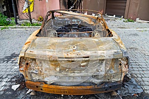 Automobile and houses in of civilians destroyed by russian weapons. Atrocities of the russian army in the suburbs of Kyiv Irpin