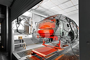 Automobile production line. ar painting. Modern car assembly plant. Red auto