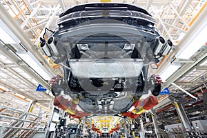 Automobile production line. Welding car body. Modern car assembly plant. Auto industry. Interior of a high-tech factory