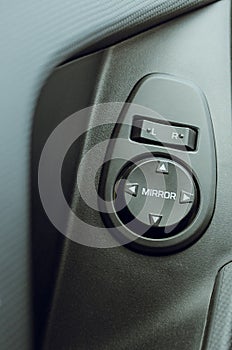 Automobile salon interior, close-up. Detail of buttons for raising and lowering car windows