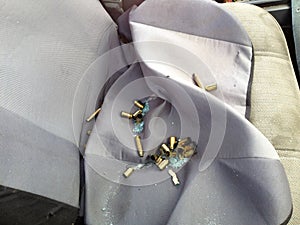 Automobile shot up bullet gun fire holes seat