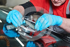 Automobile windshield glass repair service. Car glass or chip crack repairing