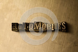 AUTOMOBILES - close-up of grungy vintage typeset word on metal backdrop