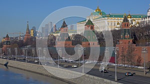 automobiles are moving on embankment of Moscow river in capital of Russia, historical and modern architecture