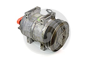 Automotive air conditioning compressor old on a white background.