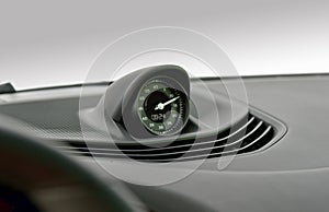 Automotive clock and ventilation holes