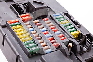 Automotive fuses box in different colors and each color is responsible for the specific value of the protection defined in amperes