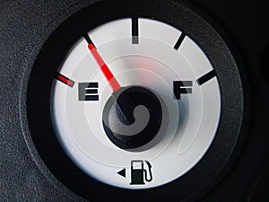 Automotive gas gauge showing nearly empty