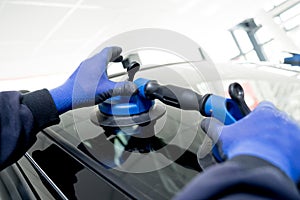 Automotive glazier equipment for replace windscreen. In auto service