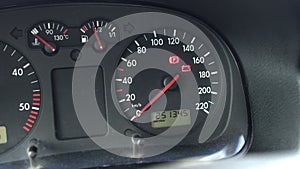 Automotive instrument panel on a diesel car on which the glow plug lights up and the service interval, close-up