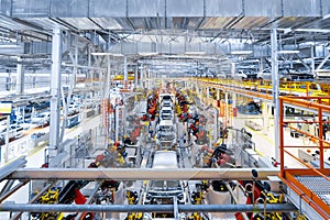 Automotive production line. Welding car body. Modern car Assembly plant photo