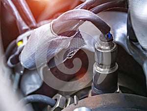 Automotive sensor lambda probe in a diesel engine. Measuring oxygen content in car exhaust gases, macro