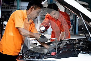 Automotive service mechanic inspect and diagnose car engine. Oxus