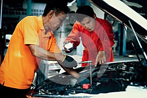 Automotive service mechanic inspect and diagnose car engine. Oxus