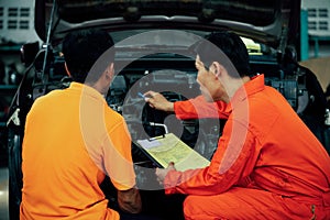 Automotive service mechanic inspect and diagnose car engine. Oxus