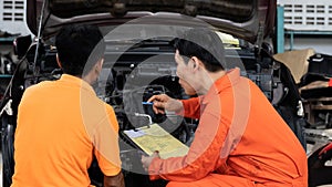 Automotive service mechanic inspect and diagnose car engine. Pano Oxus