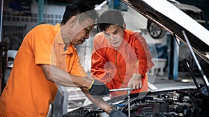 Automotive service mechanic inspect and diagnose car engine. Pano Oxus