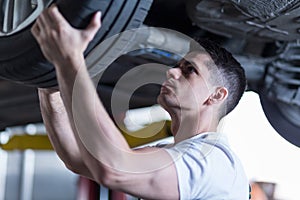 Automotive technician changing a wheel