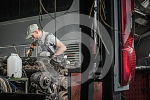 Automotive Technician Restoring Old Diesel Engine