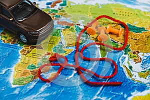 Automotive Travel Destination Points on World Map Indicated with Colorful Thumbtacks and Shallow Depth of Field.