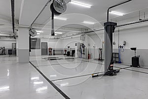 Automotive workshop, service station. New car repair center. Interior of empty car dealership. Auto Service Parking
