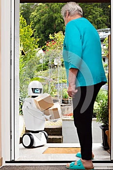 Autonomous ai artificial intelligence robot is delivering parcels or boxes