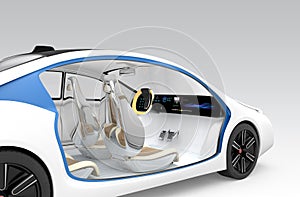 Autonomous car's interior concept. The car offer folding steering wheel, rotatable passenger seat