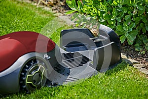 Autonomous mower moving towards charging station