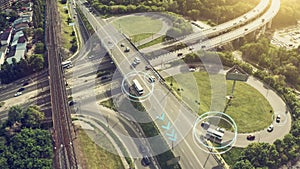 Autonomous Self Driving Cars Concept. Aerial view of cars and buses moving on city intersection and Artificial