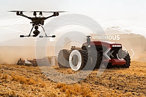 Autonomous tractor and drone photo
