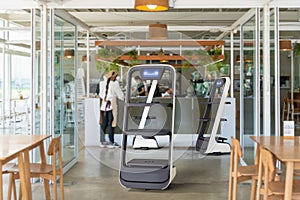 Autonomous waiter robot working in restaurant, Artificial intelligence 5G technology concept