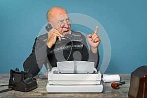 Autor of the past. Journalist at work. Desk with telephone and typewriter. Vintage. Writer editor photo