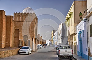 Autos near ancient Great Mosque, Kairouan, Sahara Desert, Tunisia, Africa