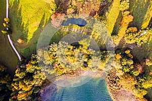 Autum Fall Top view from Drone of Lake Tegernsee and colorful Forest with trees. Lake Shore in bavaria