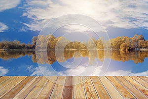 Autum landscape on the lake and Blur cloudy sky and sun light background