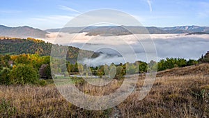 Autumn 4k footage in the Carpathian mountains of Romania , time lapse with the mist in the morning