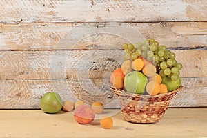 Autumn abstract composition with fruits and berries on a wooden table, harvest concept and thanksgiving background, healthy and