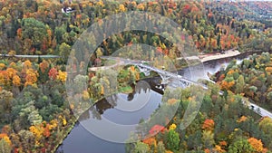 Autumn aerial landscape view of the Gauja river surrounded by forests colorful bright yellow orange and green trees