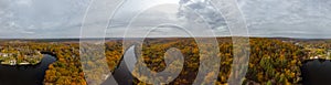 Autumn aerial panorama of colorful river valley