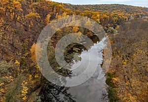 Autumn aerial river in vibrant forest scenery