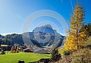 Autumn alpine Dolomites rocky  mountain scene, Sudtirol, Italy. Peaceful view near Wolkenstein in Groden, Selva di Val Gardena photo