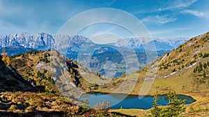 Autumn alpine Grosser Paarsee or Paarseen lake, Land Salzburg, Austria. Alps Hochkonig rocky mountain group view in far