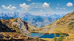 Autumn alpine Grosser Paarsee or Paarseen lake, Land Salzburg, Austria. Alps Hochkonig rocky mountain group view in far