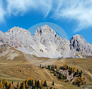 Autumn alpine mountain lake near San Pellegrino Pass, Trentino, Dolomites Alps, Italy