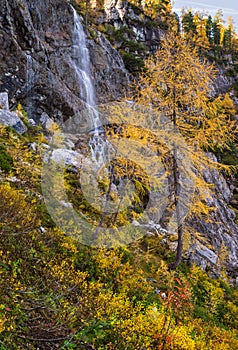 Autumn alpine waterfall view from mountain hiking path to Tappenkarsee, Kleinarl, Land Salzburg, Austria